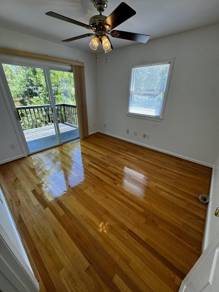 Very shiny wood floors, clean blinds, windows, and sliding glass doors after premier cleaning services in Charlotte, NC by DeJong Services LLC