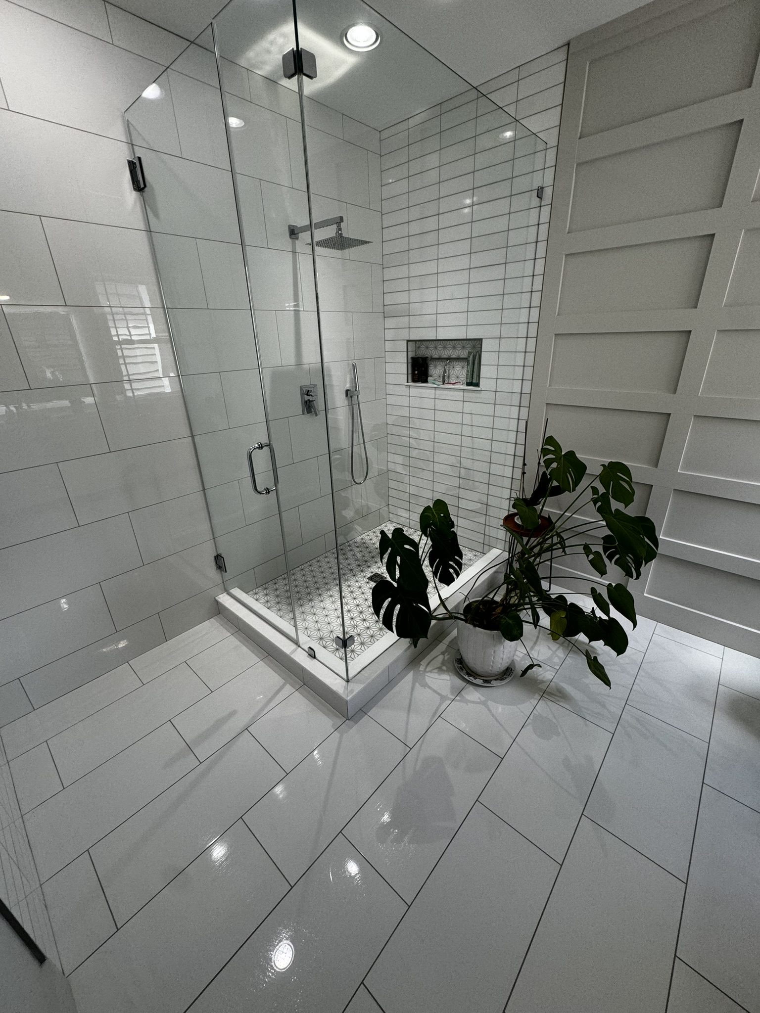 Spotless bathroom featuring crystal clear glass shower and gleaming floors, professionally cleaned by DeJong Services LLC, providing premier cleaning services in Charlotte, NC for commercial spaces